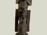 statue of a man with a shield and a shield on his head