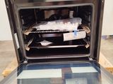 an open oven with a tray of food inside of it