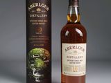 a bottle of aberlour distillery 10 years old whisky next to a cardboard box