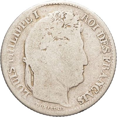 a close up of a coin with a woman ' s head on it