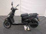 a scooter that is parked on a checkered floor