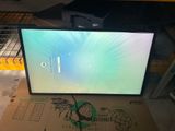 a computer monitor sitting on top of a cardboard box