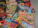 a lot of comic books that are on the table