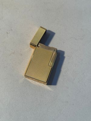 a lighter that is sitting on a white surface