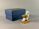 a figurine that is sitting next to a box