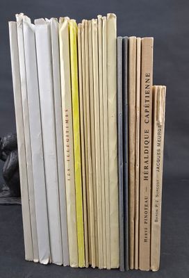 several books are stacked on top of each other on a table
