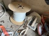 a picture of a spool and a spool of wires on the floor