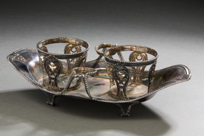 a silver tray that has three cups on it