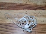 a wooden table with a pair of headphones on it