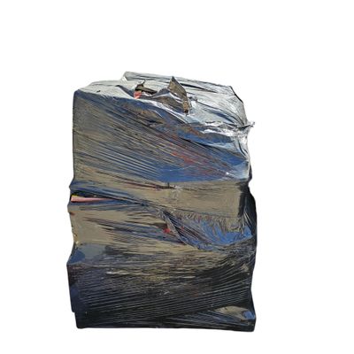 a large pile of plastic bags on a white surface