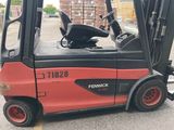 a red fork truck parked in a parking lot