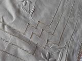 a close up of a table cloth with flowers on it