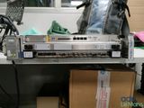 an image of a rack of computer equipment on a desk