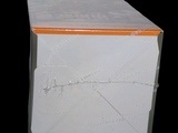 a white box with orange trim on the inside of it