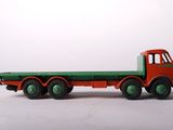 a toy truck that is sitting on a white surface