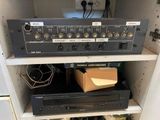 a shelf with a bunch of electronic equipment on it