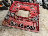 a red tool box that has a wren set in it