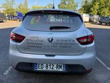 a silver car with a sticker on the back of it