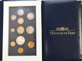 a picture of a picture of some coins in a box