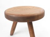 a small wooden stool with two legs on a white background