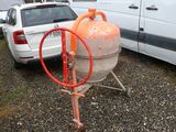 an orange fire hydrant on a cart next to a white van