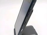 a cell phone that is sitting on top of a stand