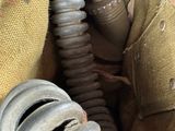 a gas mask in the back pocket of a jacket