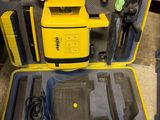 a yellow case with tools in it sitting on the floor