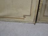 a small hole in the wall between two doors