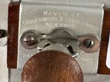 a close up of a metal object with a wooden handle