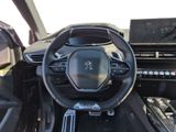 the interior of a car with a steering wheel and dashboard controls