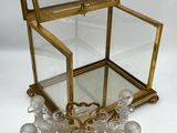 an image of a glass box with a bunch of glasses inside of it