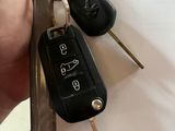 a person holding a bunch of keys in their hand