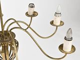 a chandelier that has five lights attached to it
