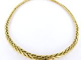 an image of a gold necklace on a white background