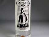 a bottle of alcohol with a skeleton on it