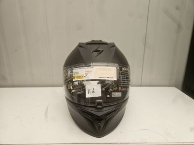 the helmet is black and has a sticker on it