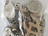 a bag of assorted silver and gold jewelry