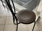 a chair that is sitting in front of a glass door