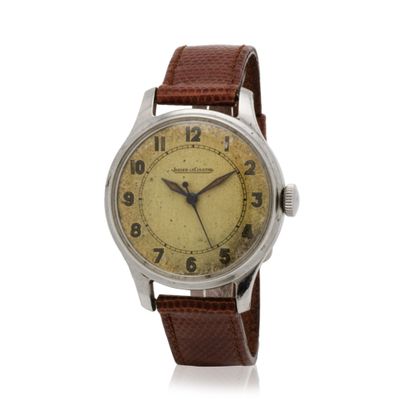 an old watch with a brown leather strap on a white background
