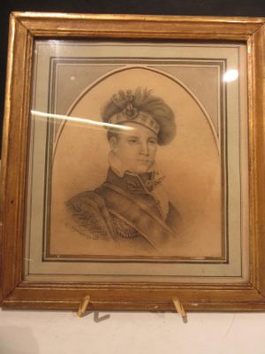 portrait of a man in a military uniform in a gold frame