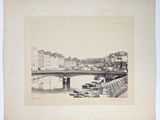 an old photo of a bridge over a body of water