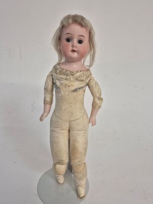 a small doll that is standing on a table