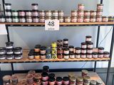many jars of food on the shelves in the store