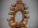 an image of a wooden sculpture of a boat with a man on it