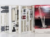 a boxed picture of a model of a crane in a box
