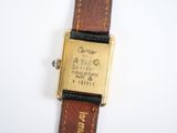 an image of a close up of a wrist watch on a white surface