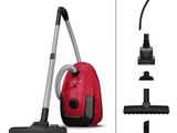 a close up of a red vacuum cleaner and a black and white vacuum