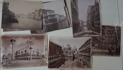 many old photos of a city on the wall