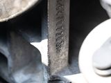 a close up of a car ' s engine with a wren on it